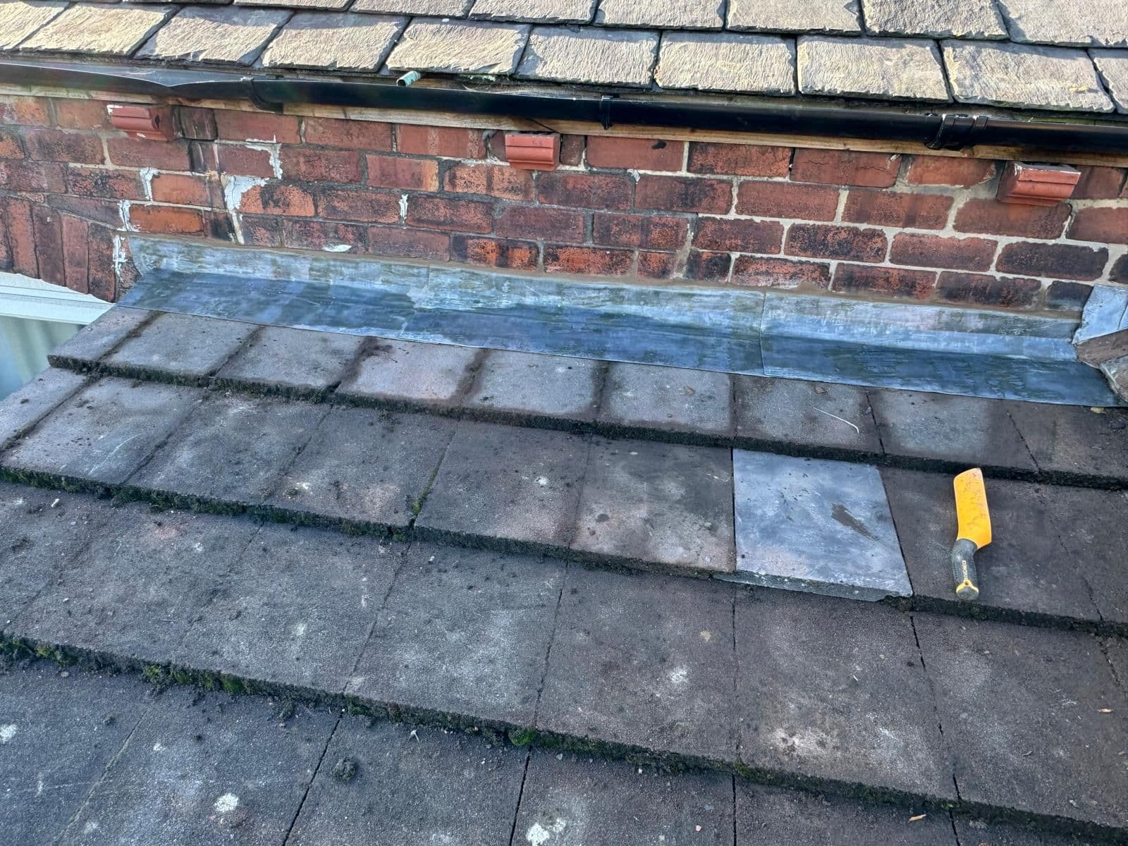 Full view: Weathered chimney vs. completed restoration — After